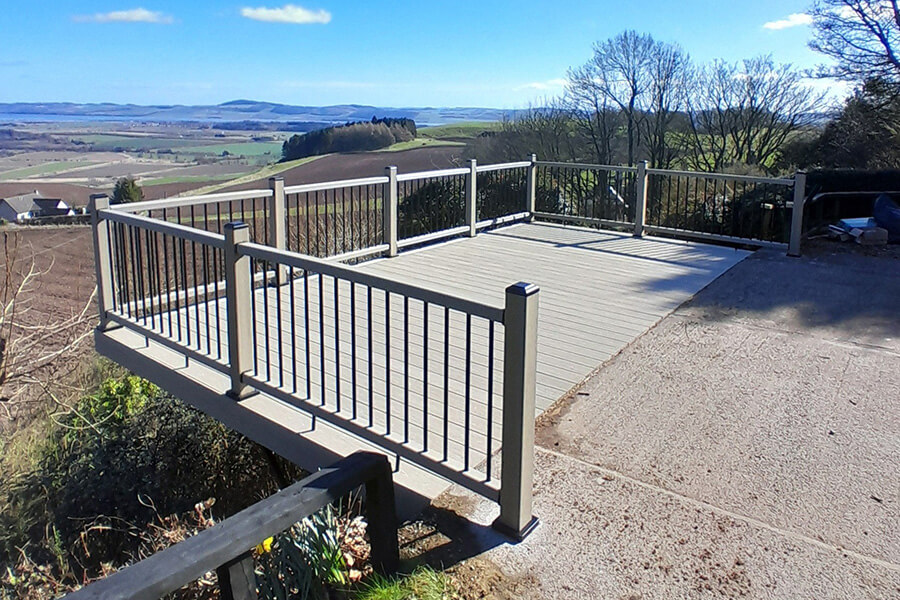Raised composite deck with metal balustrade overlooking Perthshire countryside
