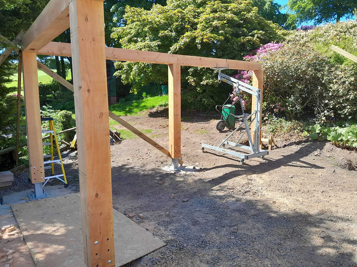 Timber car port frame taking shape with horizontal beams